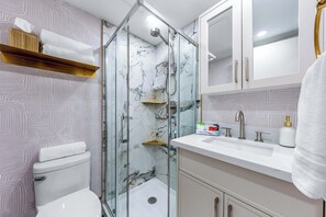 Shower, hair dryer, towels, soap