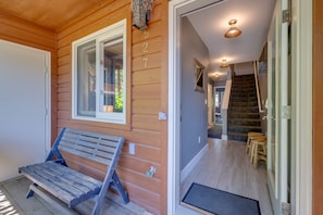A wooden exterior with a bench, a door with a number, and a staircase leading inside. - Bar7K Our Jackson Townhouse Hideaway -Walk to Town (Jackson)