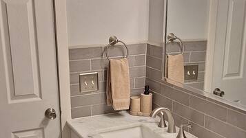 Hair dryer, towels, soap, shampoo