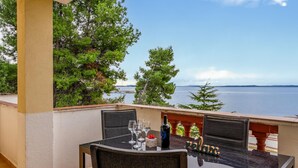 A table set for dining with a view of the sea and mountains. - 1 bedroom awesome apartment in Vir (Vir)