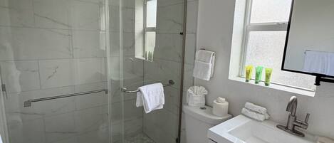 Suite, Patio | Bathroom | Shower, hair dryer, towels, soap