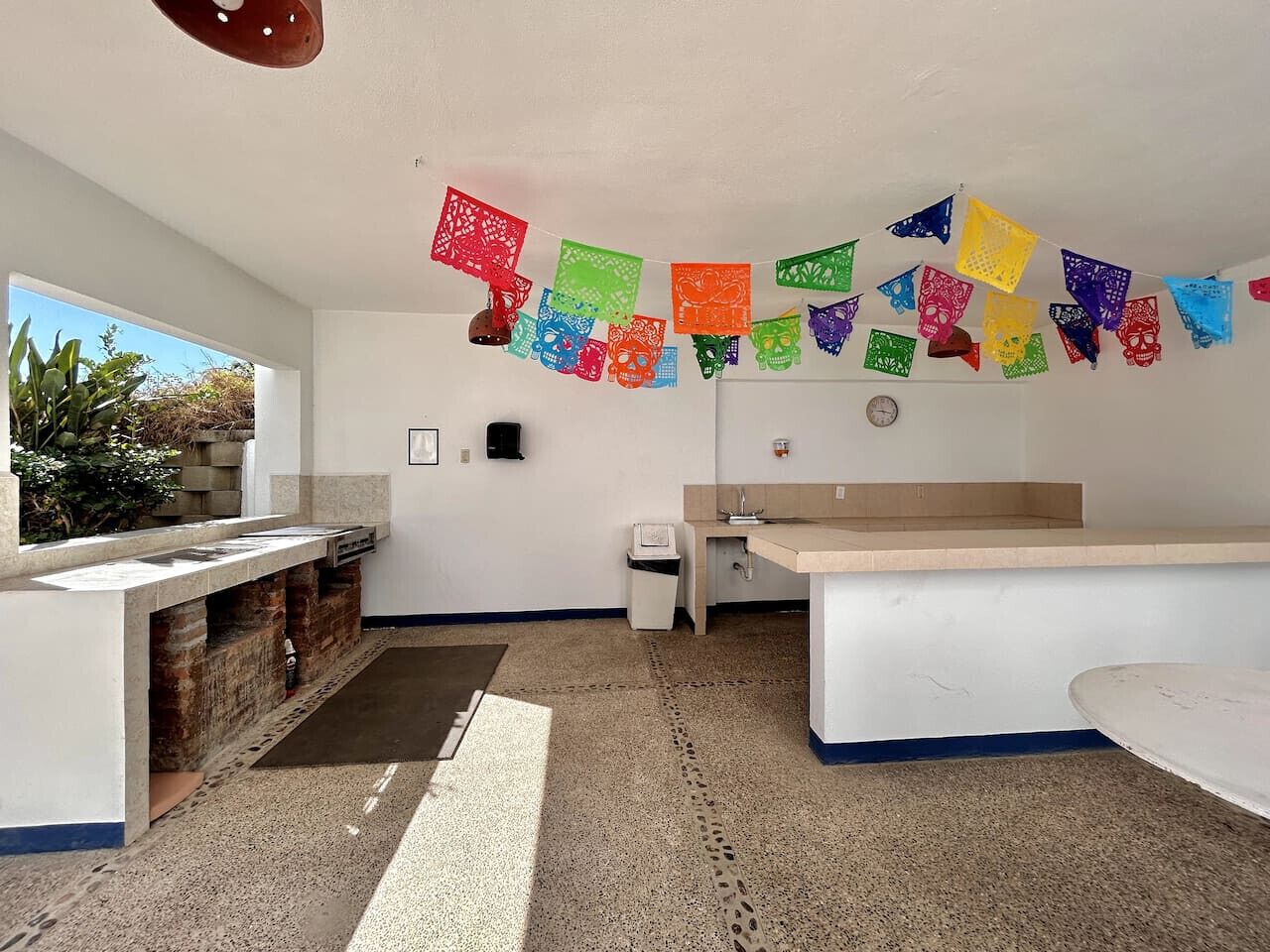 A clean, modern kitchen with a central island, a sink, and a countertop.