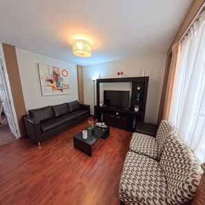 Suite Standard, vue ville | Coin séjour