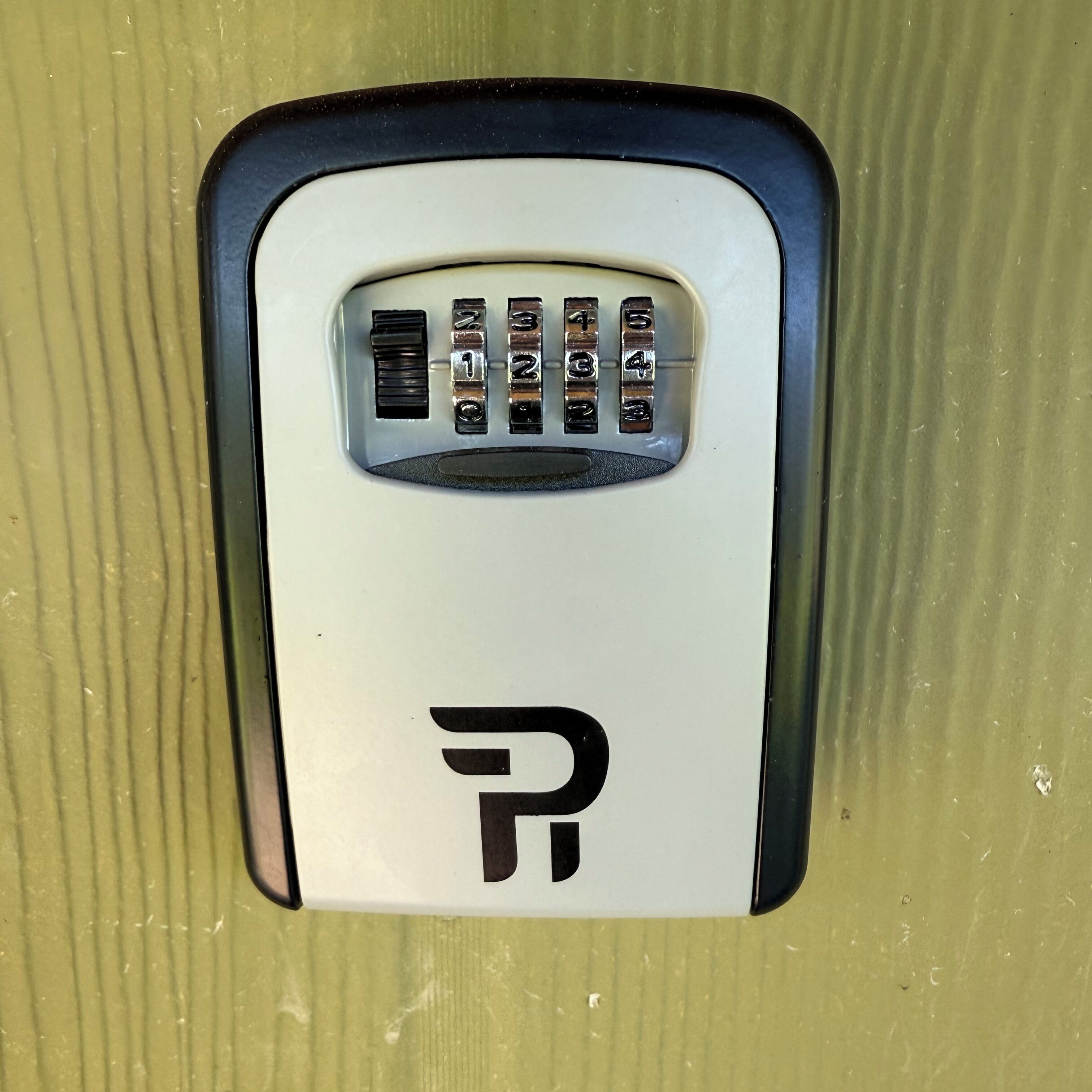 A parking meter with a keypad and a logo.