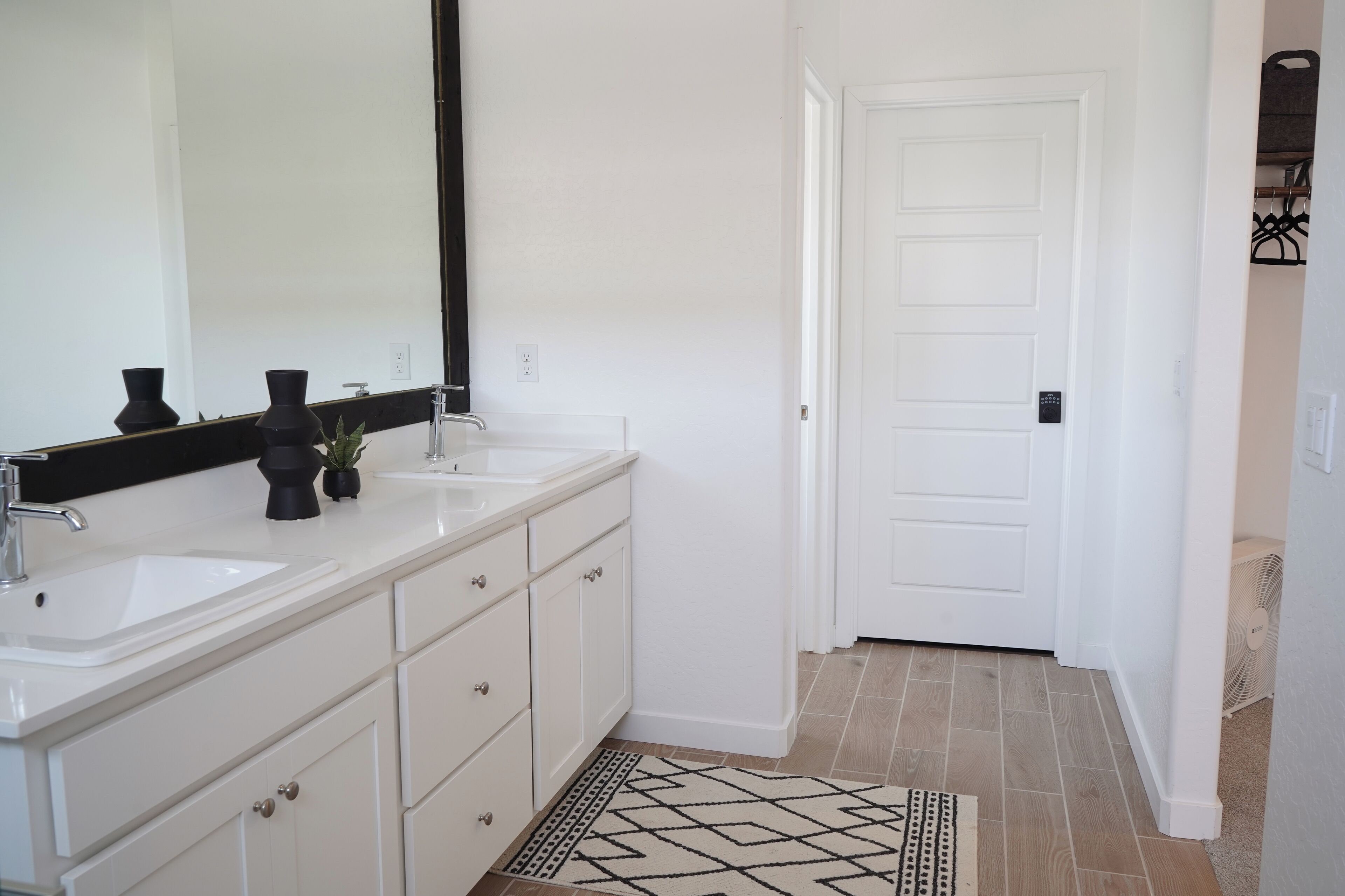 His and hers sink. Large mirror.