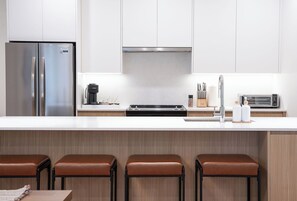 Microwave, oven, stovetop, dishwasher - Luxury Condo with Private Hot Tub (Revelstoke)