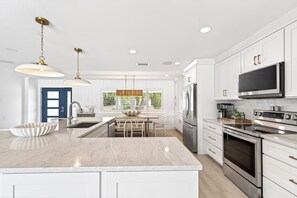 Fridge, microwave, oven, stovetop - Harbor Haven: Waterfront Home Nearby Beach w/ Heated Pool, Golf Cart & Frequent Dolphin Sightings! (Indian Rocks Beach)