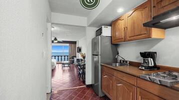 Fridge, microwave, stovetop, coffee/tea maker