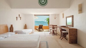 A hotel room with two beds, a desk, and a view of the sea. - 4 BR Penthouse - Breathtaking Views - Private Pool (Zihuatanejo)