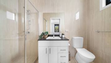 Shower, hair dryer, towels, soap