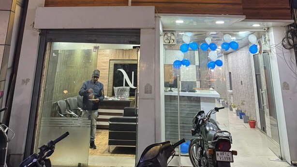 A hotel entrance with a sign reading "HOTEL NATRAJ". - Hotel Natraj A Boutique Hotel (Haridwar)