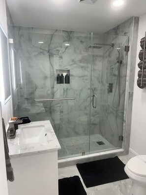 Shower, hair dryer, towels, soap