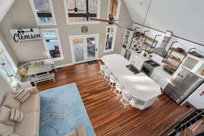 A spacious kitchen with a central island, white cabinetry, and stainless steel appliances. - Close to Clemson with a beautiful view of Keowee! (Seneca)