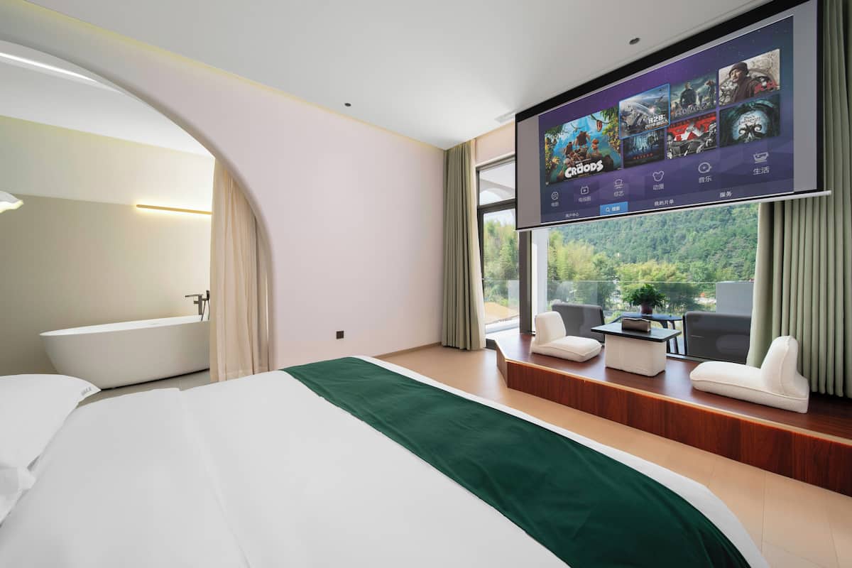 Premium bedding, desk, laptop workspace, blackout curtains