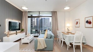 Living area - Burj Khalifa & Canal View Stylish 2BR Apartment (Dubai)