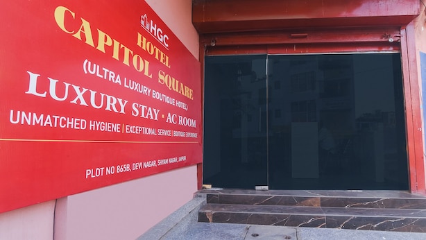 A red sign for the Capitol Hotel, indicating it is an HGC hotel with a luxury boutique hotel and AC room. - Via Capitol Square (Jaipur)