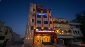 The Sri Balaji Grand Hotel with a prominent entrance, a signboard, and string lights. - Fabhotel Sri Balaji Grand (Hyderabad)