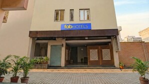 A modern building with a sign reading "fabHOTELS" on the facade. - Fabhotel Shri Vishwanath (Varanasi)