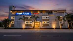 A modern hotel with a prominent 'fabHOTELS' sign, 'ARSH EXECUTIVE INN' branding, and 'SKY Meridian Lounge' on the facade. - Fabhotel Arsh Executive Inn (Kalyan)