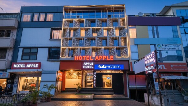 A hotel named 'Hotel Apple' with a modern facade, multiple floors, and a well-lit entrance. - FabHotel Apple - Nr. by ITI (Indore)
