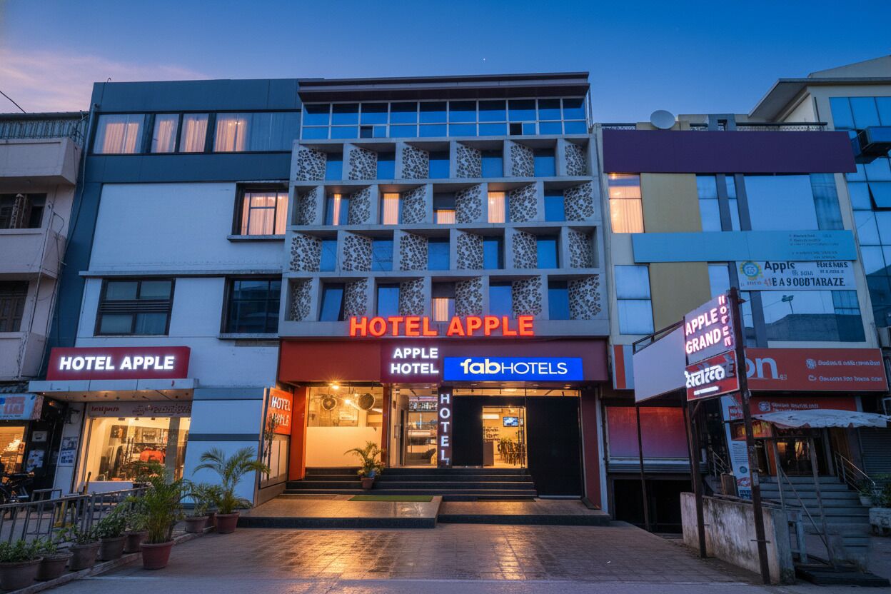 A hotel named 'Hotel Apple' with a modern facade, multiple windows, and a visible entrance.