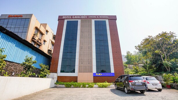 A hotel with a modern facade, featuring a prominent sign for 'Hotel Gavali Deva' and 'Fab Hotels'. - Fabhotel Gavalidev (Navi Mumbai)