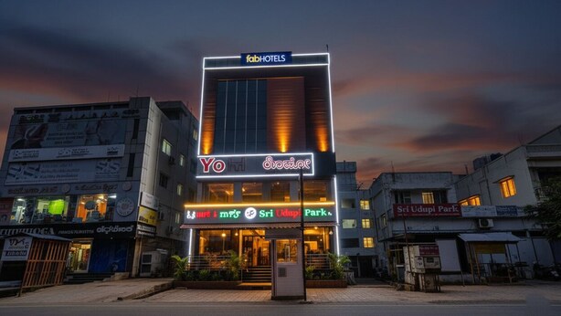 A hotel with a prominent 'fabHOTELS' sign, 'Yo' branding, and 'Sri Udupi Park' signage. - Fabhotel Sri Udupi Park (Bengaluru)