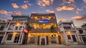 A multi-story building with a prominent 'fabHOTELS' sign. - FabHotel AMR Grand (Kanpur)