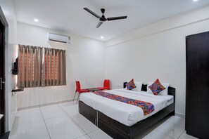 ห้องดีลักซ์ | ผ้าปูที่นอนฝ้ายอียิปต์, เครื่องนอนระดับพรีเมียม, ตู้นิรภัยในห้องพัก