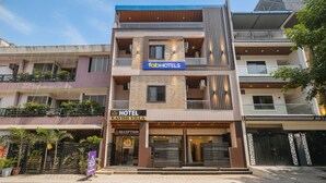 A modern multi-story hotel with a reception area, balconies, and a sign for 'fabHOTELS'. - Fabhotel Kavish Villa (Indore)
