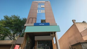 A tall building with a sign reading 'KD PLAZA' and 'Via' on the lower part. - Via KD6 Plaza Residency (New Delhi)