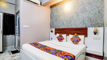 Deluxe-værelse | Egyptiske bomuldslagner, premium-sengetøj, pengeskab på værelset