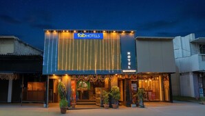 A hotel with a modern facade, a prominent sign reading "fabHOTELS HOTEL", and a well-lit entrance. - Fabhotel Jk (Mumbai)