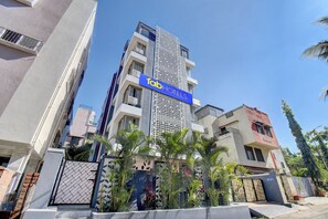 A modern hotel building with a prominent 'Tab Hotels' sign. - Fabhotel Rajyog Residency (Pune)
