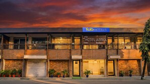 A hotel with a sign for 'Hotel Abrol Suites' under a 'fob hotels' sign. - Fabhotel Abrol Suites (Mumbai)