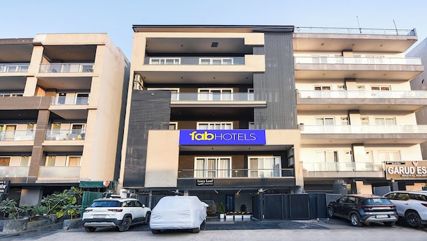 A multi-story hotel with a prominent 'Fab Hotels' sign. - FabHotel Ivory Leaf- Nr Artemis Hospital Gurgaon (Gurugram)