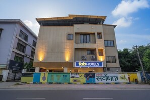 A building with a sign for 'fabHOTELS'. - Via Blissful Stays (Navi Mumbai)