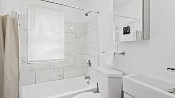 Hair dryer, towels, soap, toilet paper