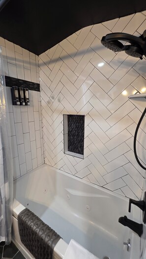 Jetted tub, hair dryer, towels, soap