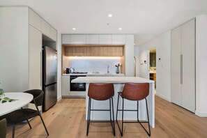 Fridge, microwave, dishwasher, dining tables