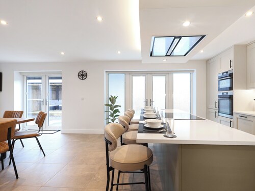 Stylish modern home with games room, luxury kitchen and two en suite bedrooms.