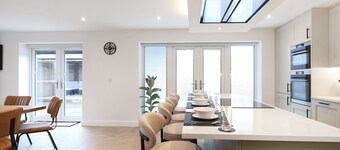 Stylish modern home with games room, luxury kitchen and two en suite bedrooms.