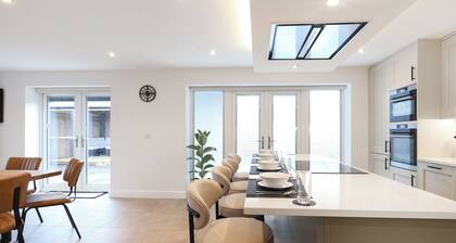 Stylish modern home with games room, luxury kitchen and two en suite bedrooms.