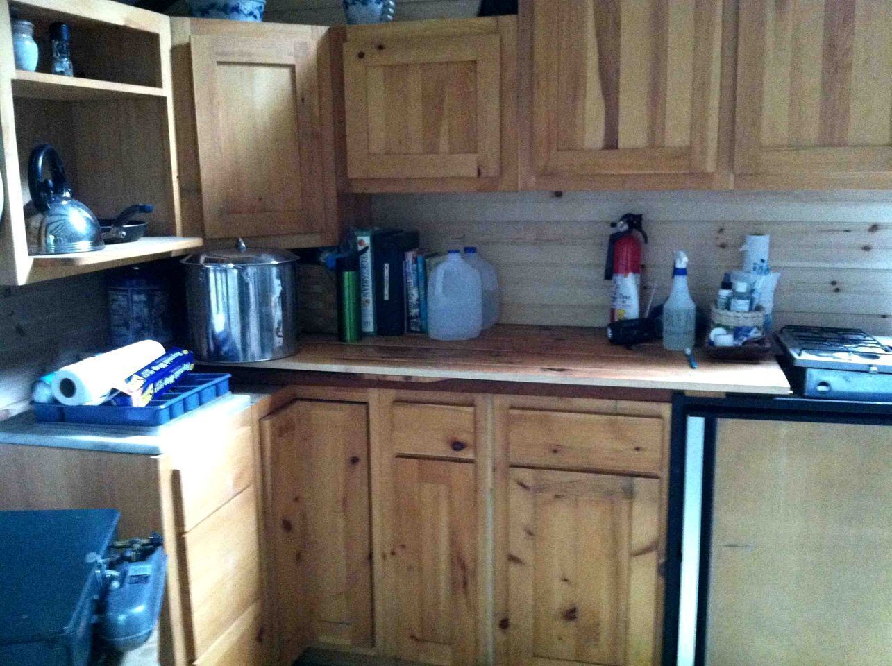 Fridge, stovetop, electric kettle, cookware/dishes/utensils