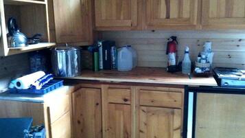 Fridge, stovetop, electric kettle, cookware/dishes/utensils