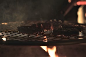 A grill with food being cooked.