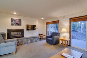 TV, fireplace, books - Woodsy Winter Park Condo w/ Pool & Hot Tub Access (Winter Park)