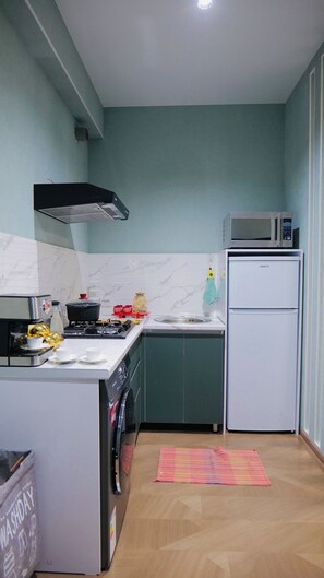 Apartment, Balcony, City View | Private kitchen | Fridge, microwave, oven, stovetop - COZY APARTMENT 5 MIN TO OLD CITY BUKHARA (Bukhara)