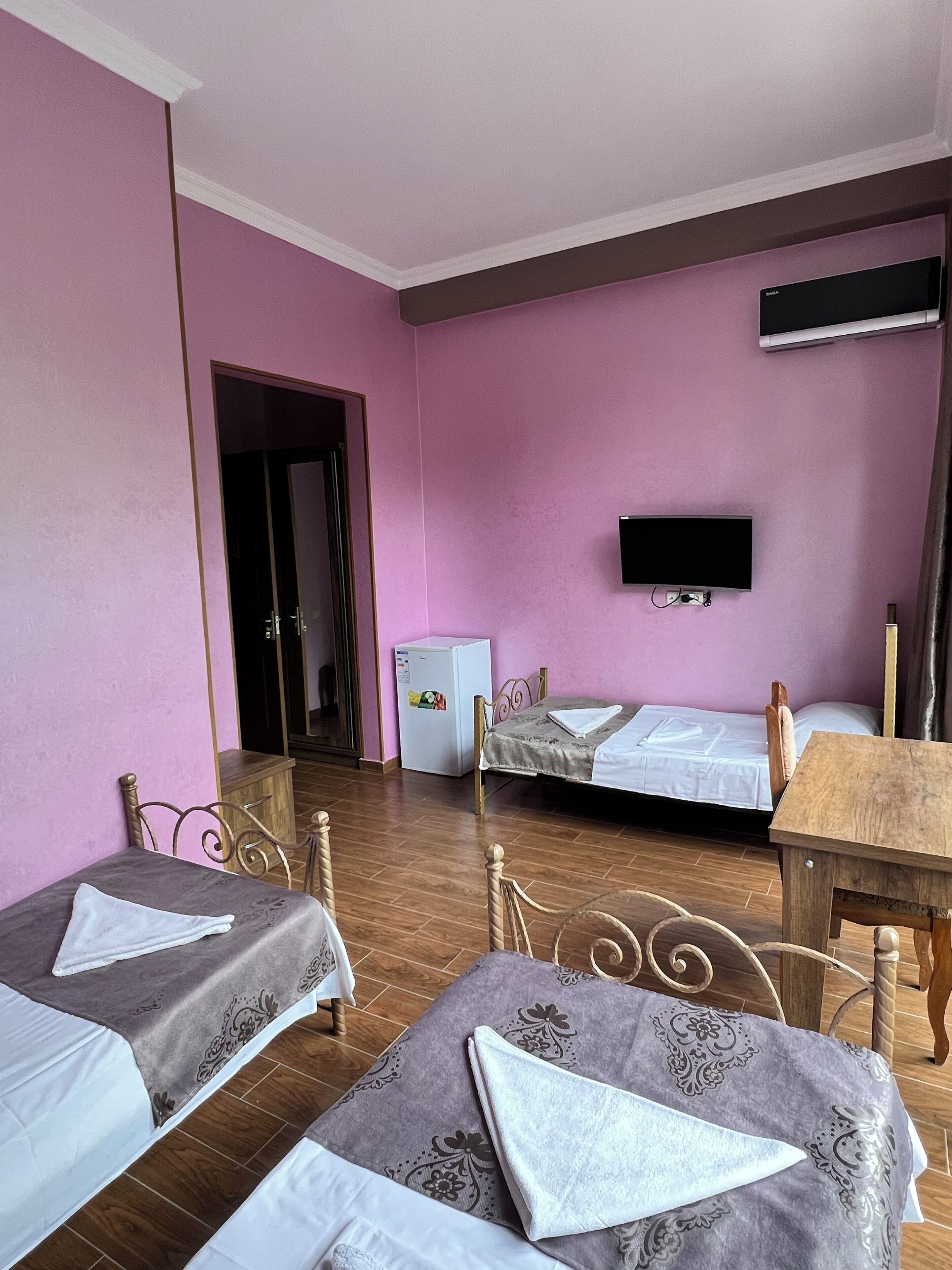 Economy Triple Room, Patio, Courtyard View | In-room safe, iron/ironing board, free WiFi, bed sheets