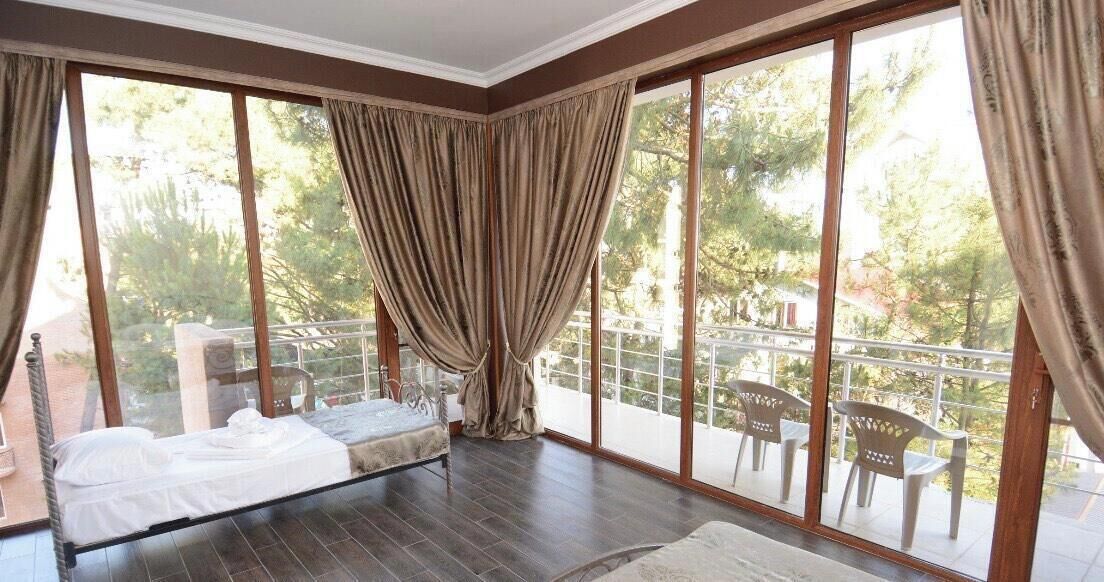 Deluxe Quadruple Room | In-room safe, iron/ironing board, free WiFi, bed sheets